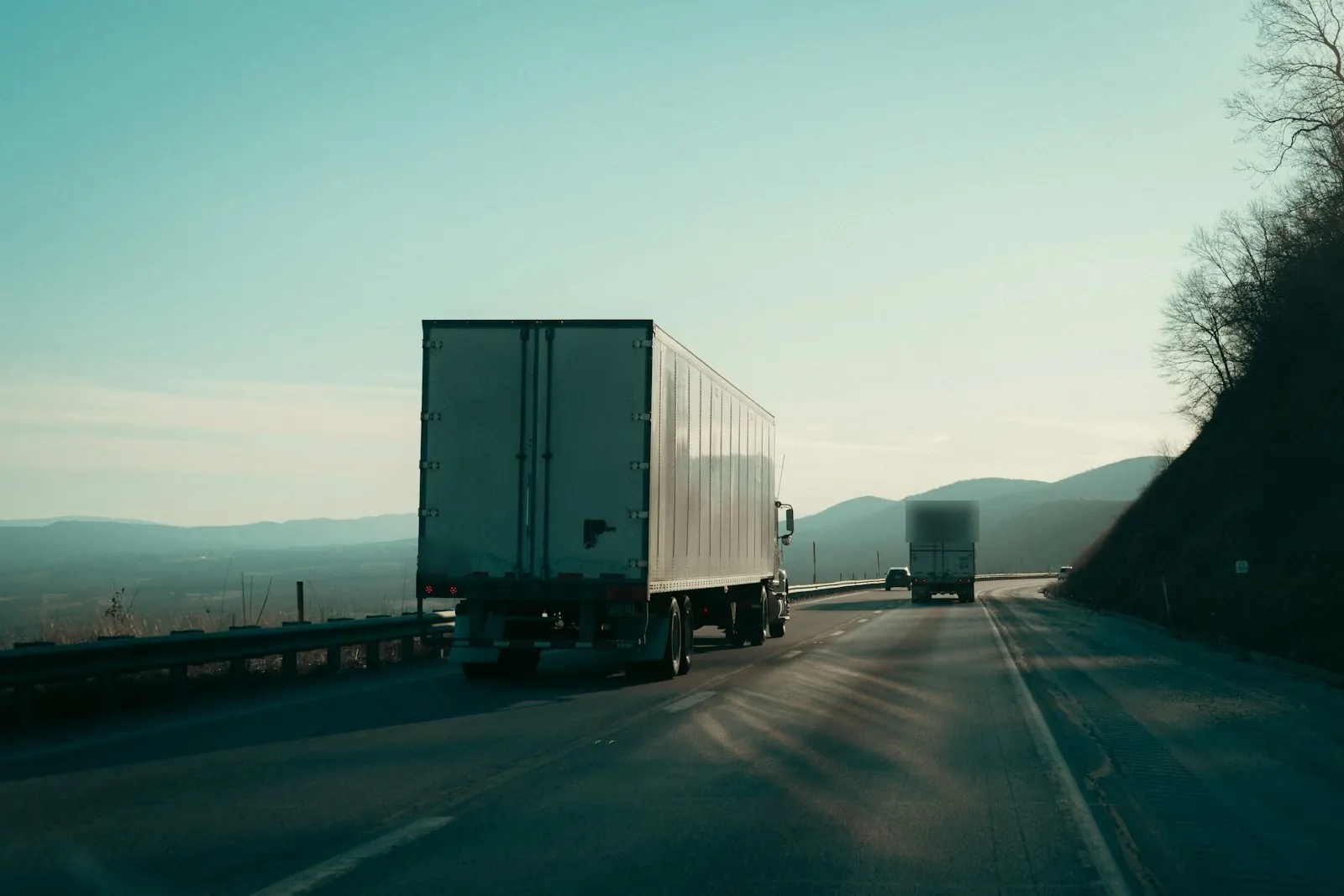 Two semi trucks on a mountain road in Virginia