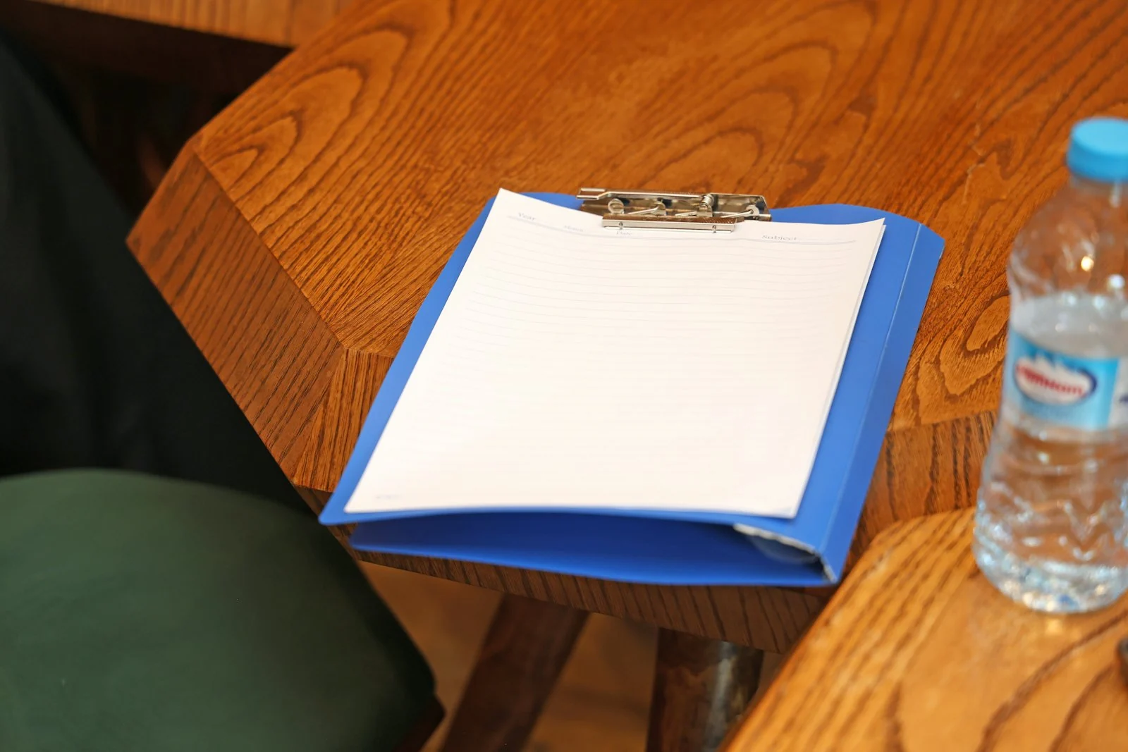 A blank clipboard on a desk
